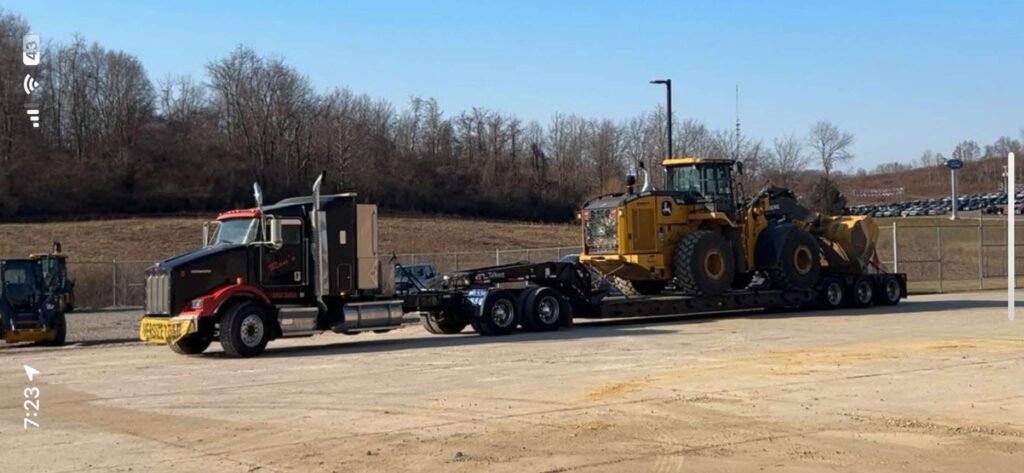 Jackson Ohio Ron's Garage towing Semi oversize load hauling loader with landoll flatbed